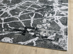 dark grey and black rug